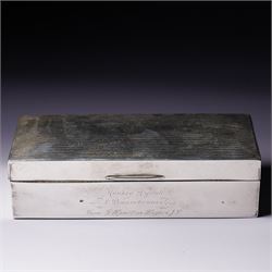 Silver rectangular cigarette box with engine turned cover engraved with initials and prese...