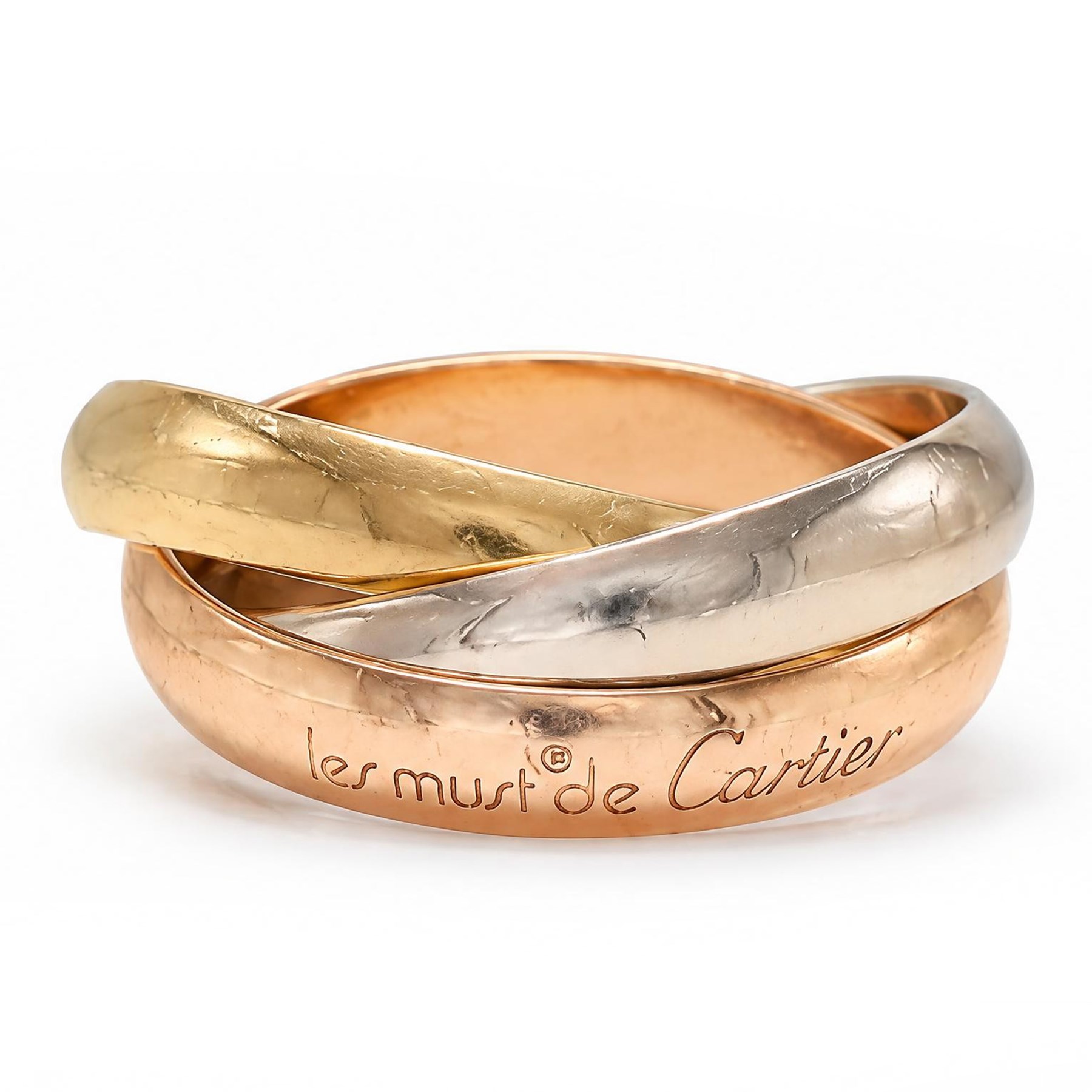 Les must de Cartier 18ct gold Trinity ring, with three interlinked rose, white and yellow gold bands, with certificate dated 1983