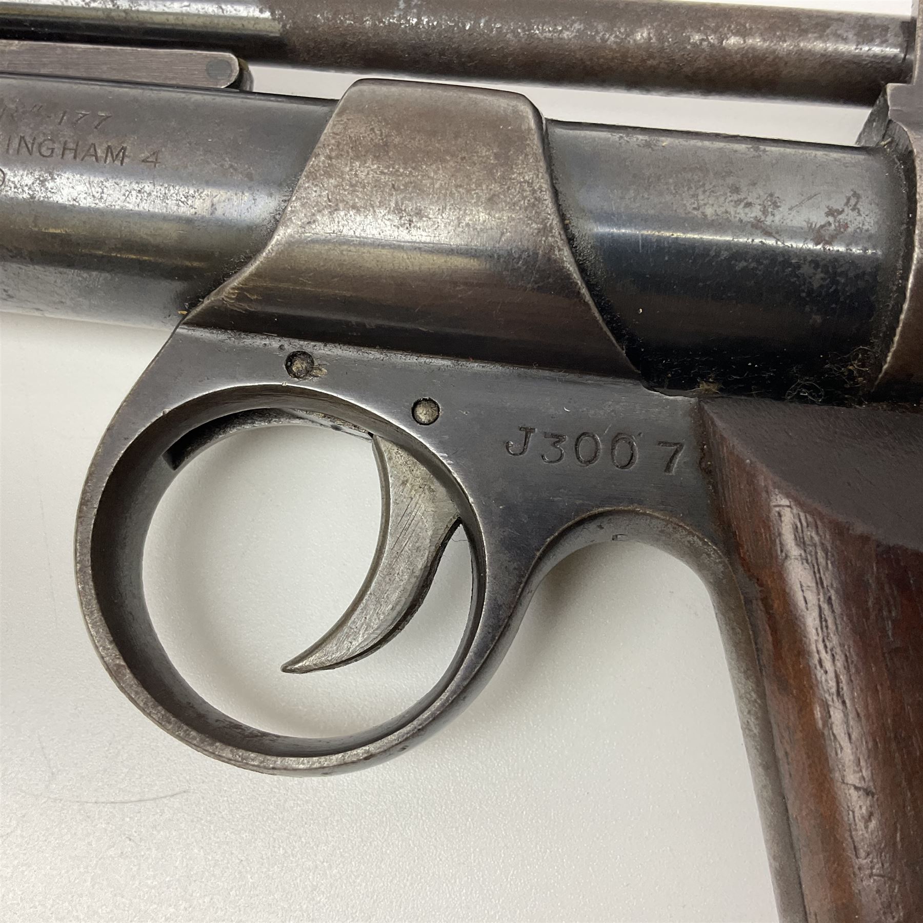 Webley 'Junior' .177 air pistol with top lever action and wooden grips; marked The Webley Junior .177 Webley & Scott Ltd Birmingham 4 Made in England to left side of cylinder; numbered 078 to muzzle and J3007 to trigger guard; L21cm; together with part tin of Webley .177 Special Pellets NB: AGE RESTRICTIONS APPLY TO THE PURCHASE OF THIS LOT.