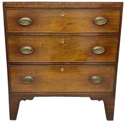 Regency mahogany chest, rectangular top with ebony stringing, fitted with three graduating cock-beaded drawers, each with pressed brass oval handle plates with scrolling anthemion detail and bone escutcheons, raised on bracket feet