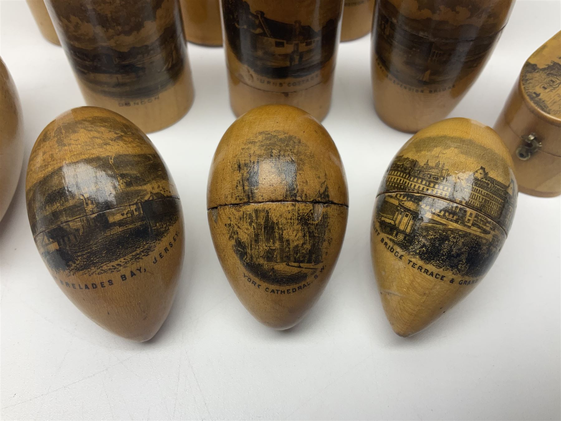 Collection of Mauchline ware relating to sewing, to include four ovoid shaped thimble cases, hinged lid thimble case and needle cases (12) 