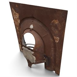 Late Victorian black-painted cast iron fireplace, the arched surround with anthemion cartouche and guilloche-moulded border, enclosing a bow-front fire basket with finialled standards, railed front and leaf-cast apron, with sheet-metal backplate