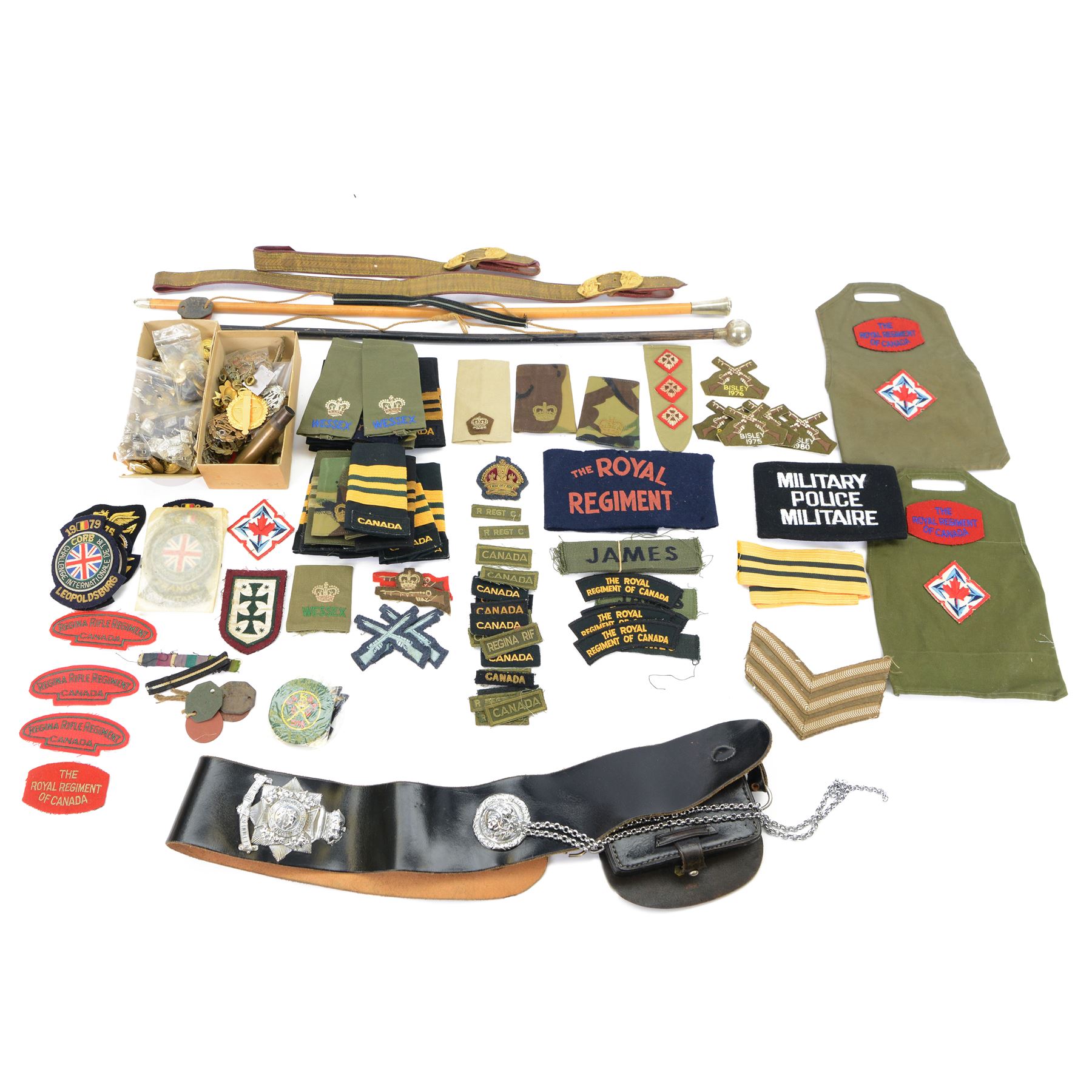 Large collection of militaria items, including RAF dog tags, The Royal Grenadiers belt buckle, Royal Regiment of Canada swagger stick, insignias including marksman badge etc