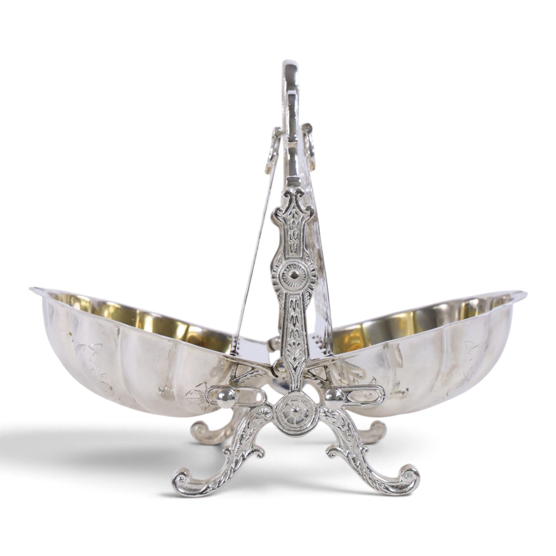 Silver-plated Victorian style biscuit box, in a shell form with engraved leaf detailing, upon scroll feet, H24cm