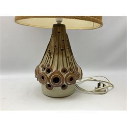 Large brown and cream glazed pottery table lamp with pierced decoration, with a hessian lampshade, H68cm   