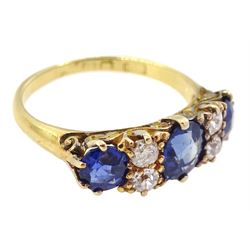 Early 20th century 18ct gold three stone cushion cut sapphire and four stone old cut diamond ring, total sapphire weight approx1.85 carat, total diamond weight approx 0.30 carat