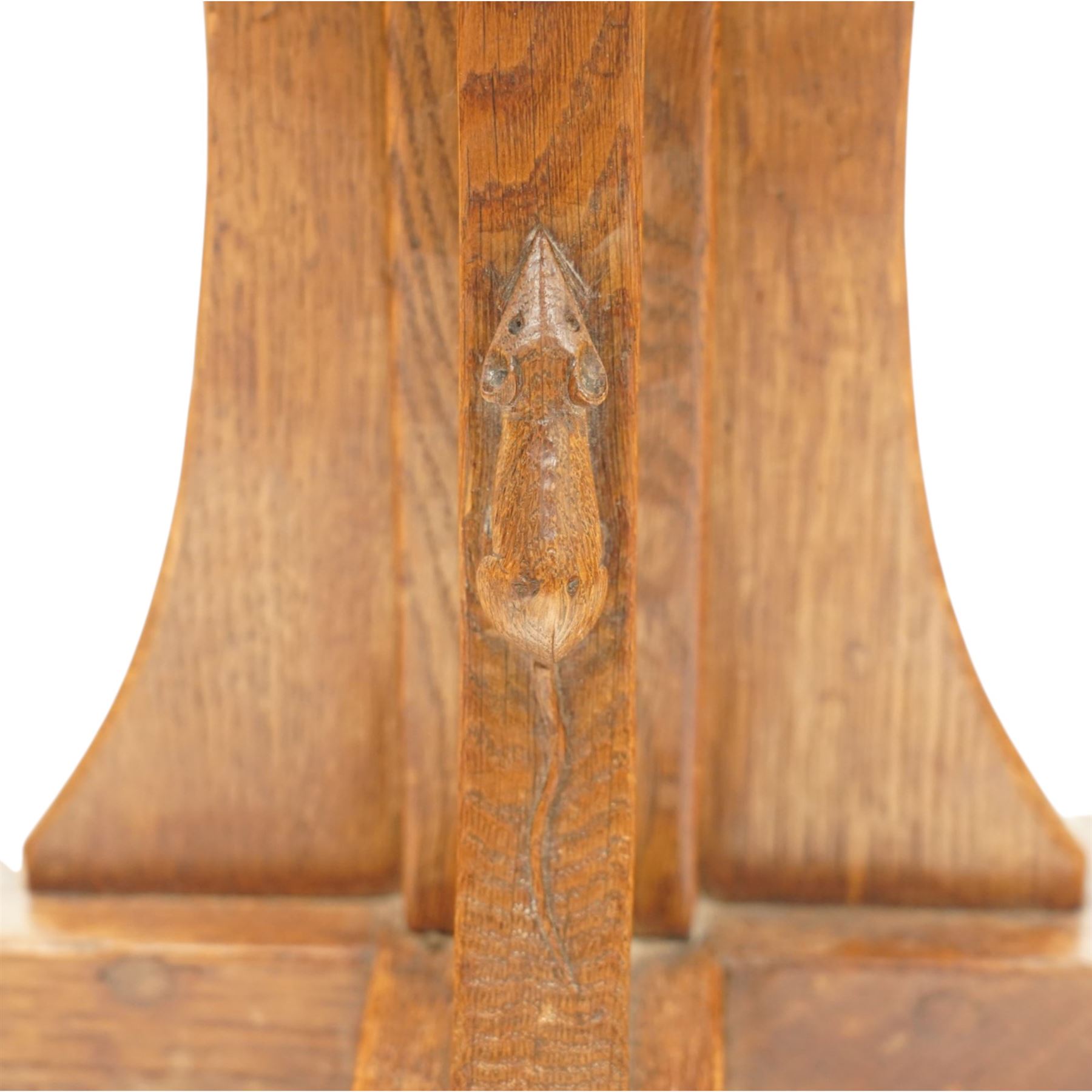 Mouseman - early 20th century adzed and figured burr oak coffee table of small proportions, the octagonal lightly adzed burr top raised on cruciform base and sledge feet, carved with tall mouse signature, by the workshop of Robert Thompson of Kilburn 