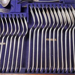 Canteen of Edwardian silver Old English pattern cutlery for twelve covers comprising twelve table forks, twelve dessert forks, twelve soup spoons, twelve dessert spoons, eleven tea spoons, pair of sauce ladles, four table spoons and a basting spoon in oak case London 1907 Maker Charles Boyton & Son