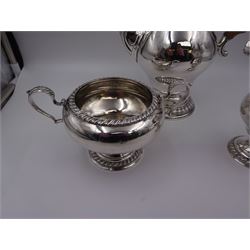 Mid 20th century three piece silver coffee service, comprising coffee pot, milk jug and twin handled open sucrier, of waisted form upon circular domed foot,  with oblique gadrooned rim, the milk jug and sucrier with acanthus capped handles, the coffee pot with wooden handle and finial, hallmarked William Comyns & Sons Ltd , London 1961, coffee pot H27.5cm