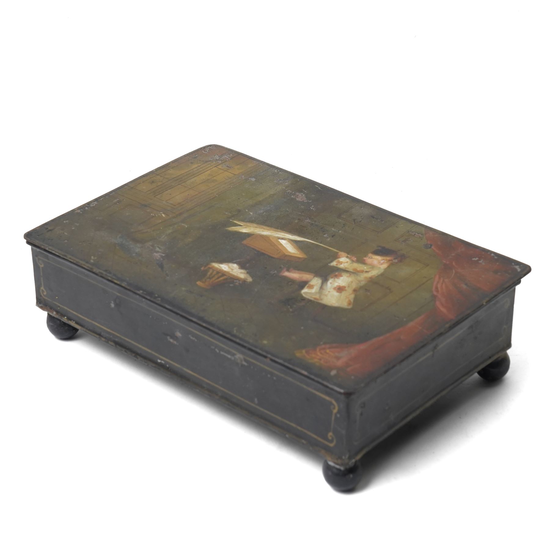 19th century toleware stationary or wafer box, possibly German, with painted cover depicting a child holding oversized quill, seated at a davenport, W20.5cm D13.5cm