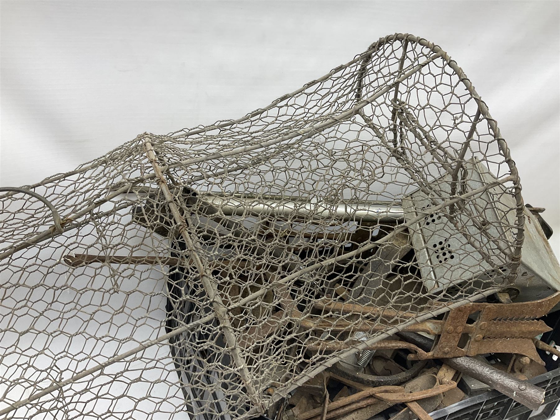 Quantity of animal traps including, gin traps, eel spears, Young's sparrow trap etc, Auctioneer's Note: These traps are sold as artefacts for ornamental purposes only as the use of some of them may be illegal