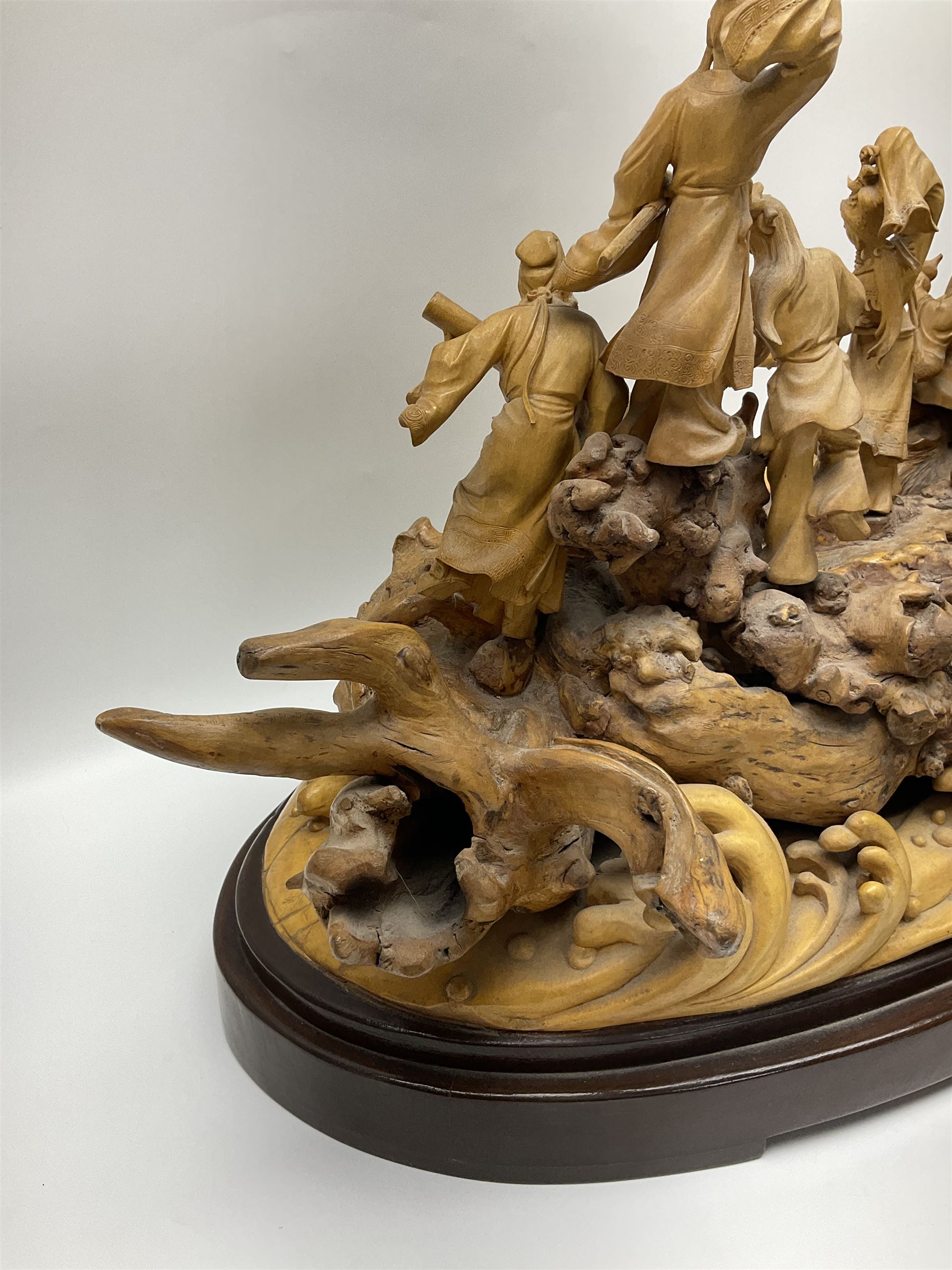 Large Chinese wood carving, depicting the eight immortals crossing the sea, H46cm, L78cm 