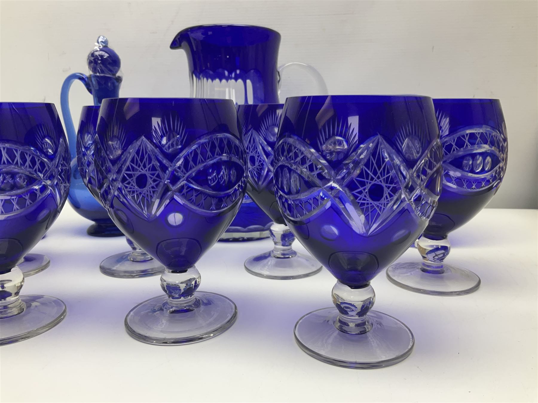 Bristol blue glass jug, together with blue claret jug, saucer, blue cut