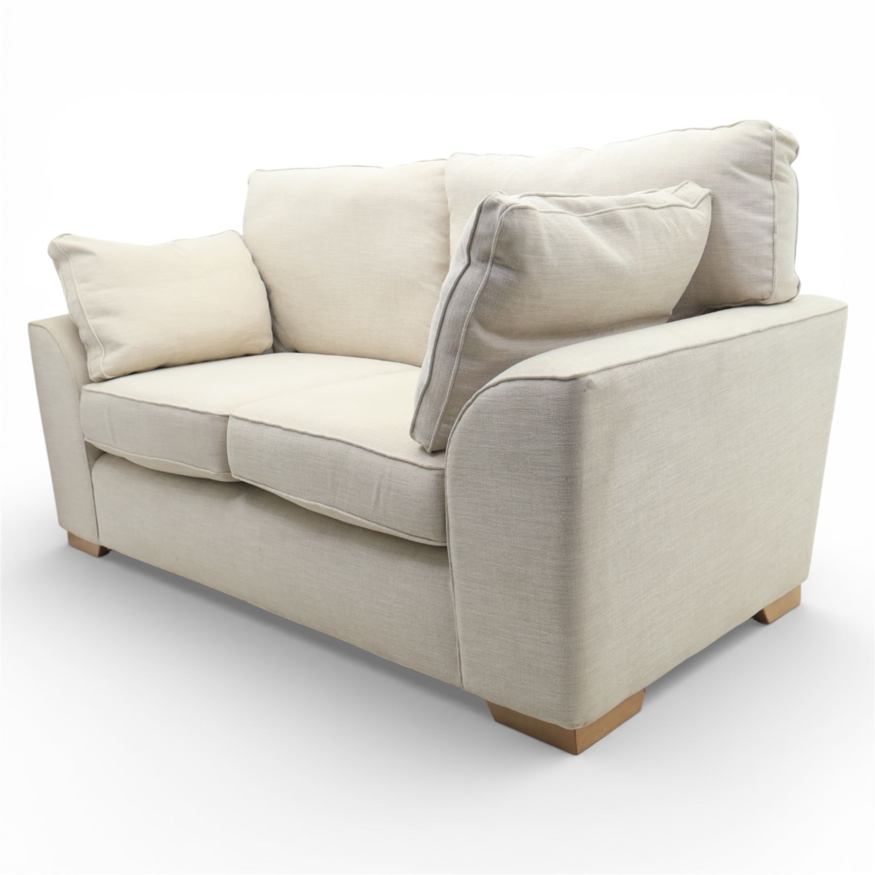 Next Home - Contemporary two seat sofa, square back and arms, upholstered throughout in beige fabric, fitted with two loose seat cushions and two loose back cushions, with arm cushions, raised on block wooden feet