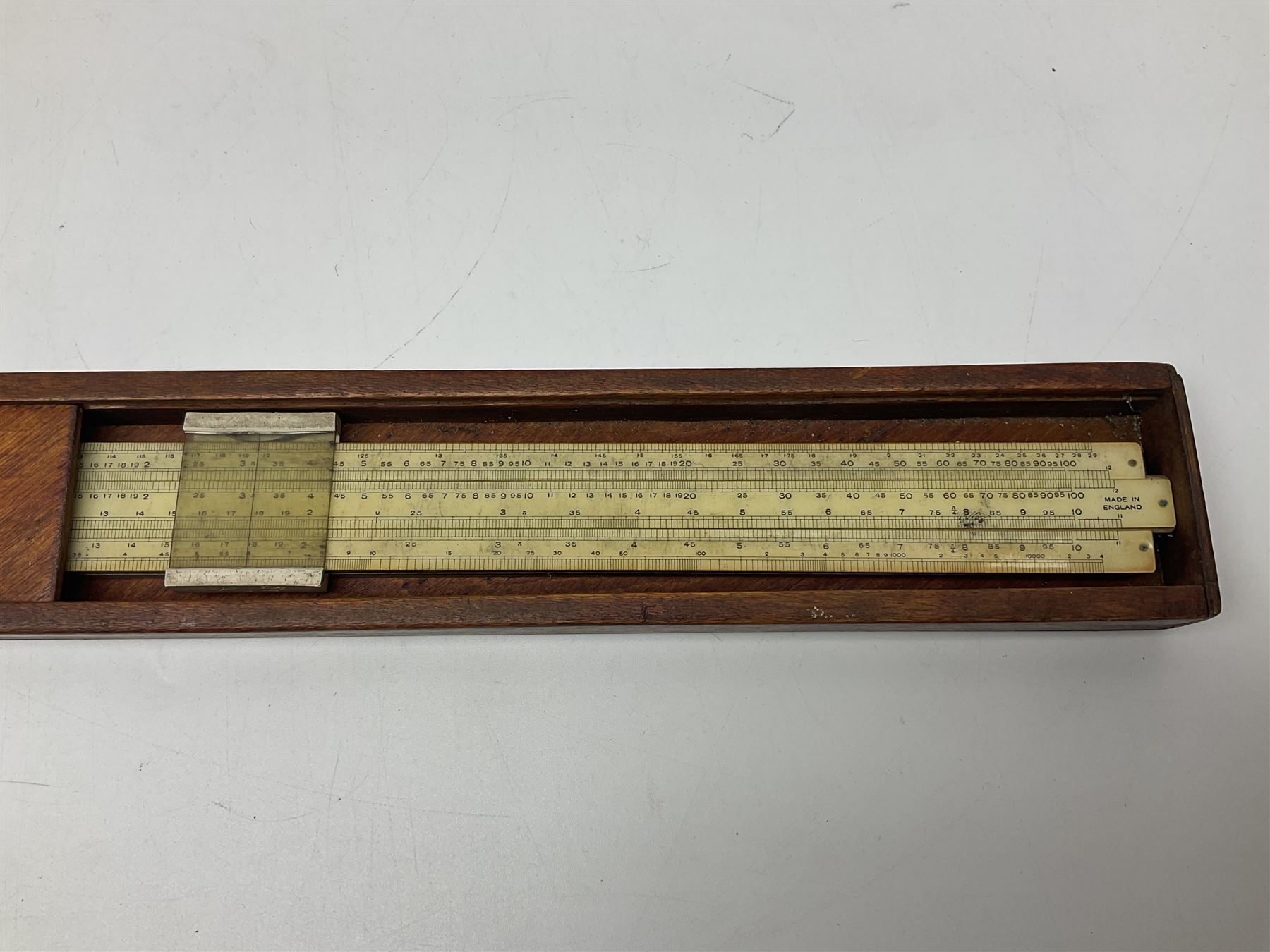 Pair of turned wooden goblets, six hardstone eggs, vintage slide rule and a leather letter rack, etc