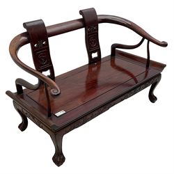 20th century Chinese hardwood two-seat bench, horseshoe arms with scroll carved terminals, two upright back splats with carved and pierced decoration, panelled seat over frieze carved with dragons, on paw carved cabriole feet
