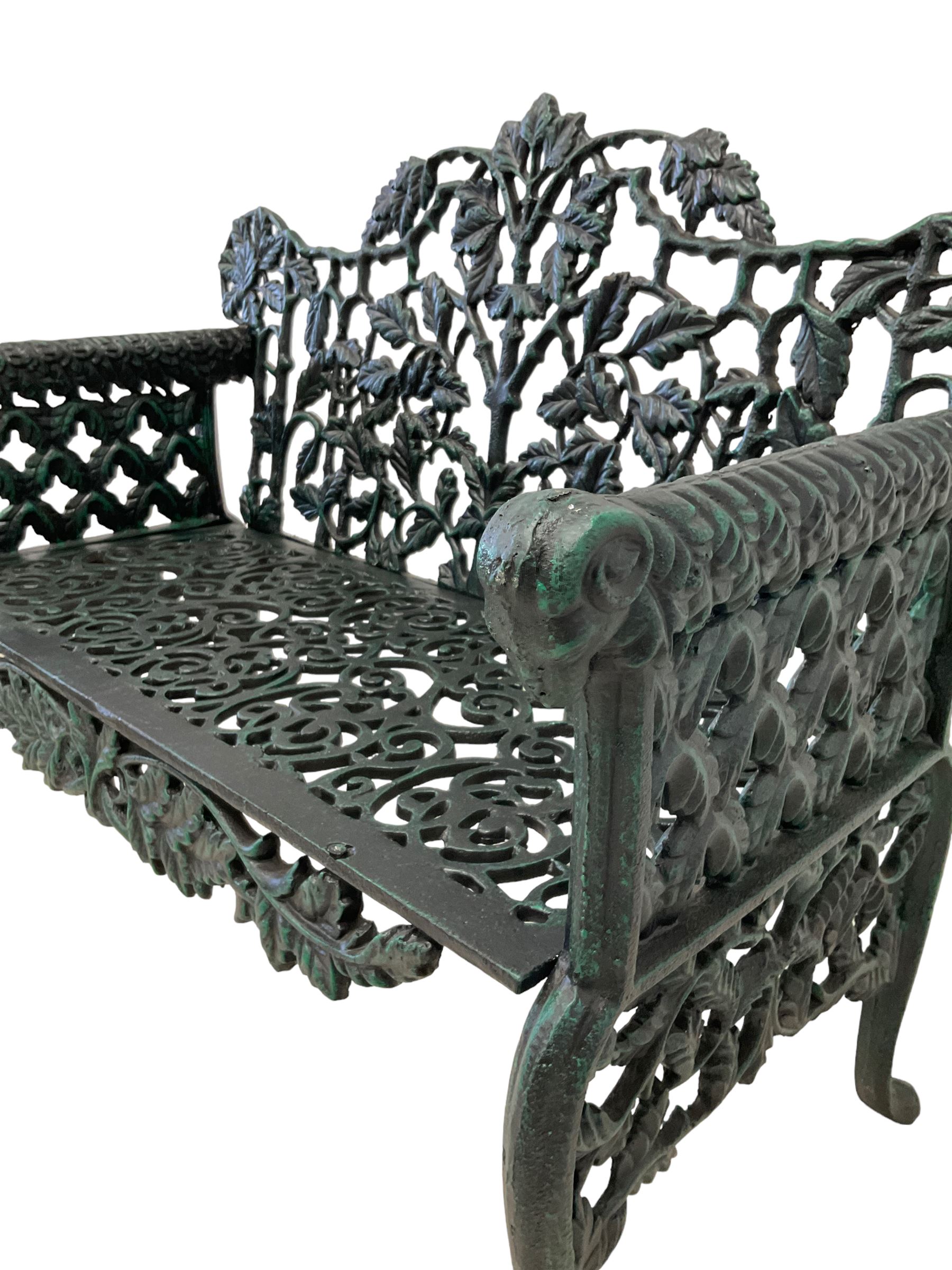 Victorian design cast iron bench, tailing oak leaf and branch pattern, rams head arm terminals