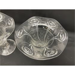 Pair of Art Nouveau clear glass vases in the manner of Stuart & Sons, of bell form with fluted rim, with relief and cut floral decoration, upon twisted stem and circular foot, H17cm