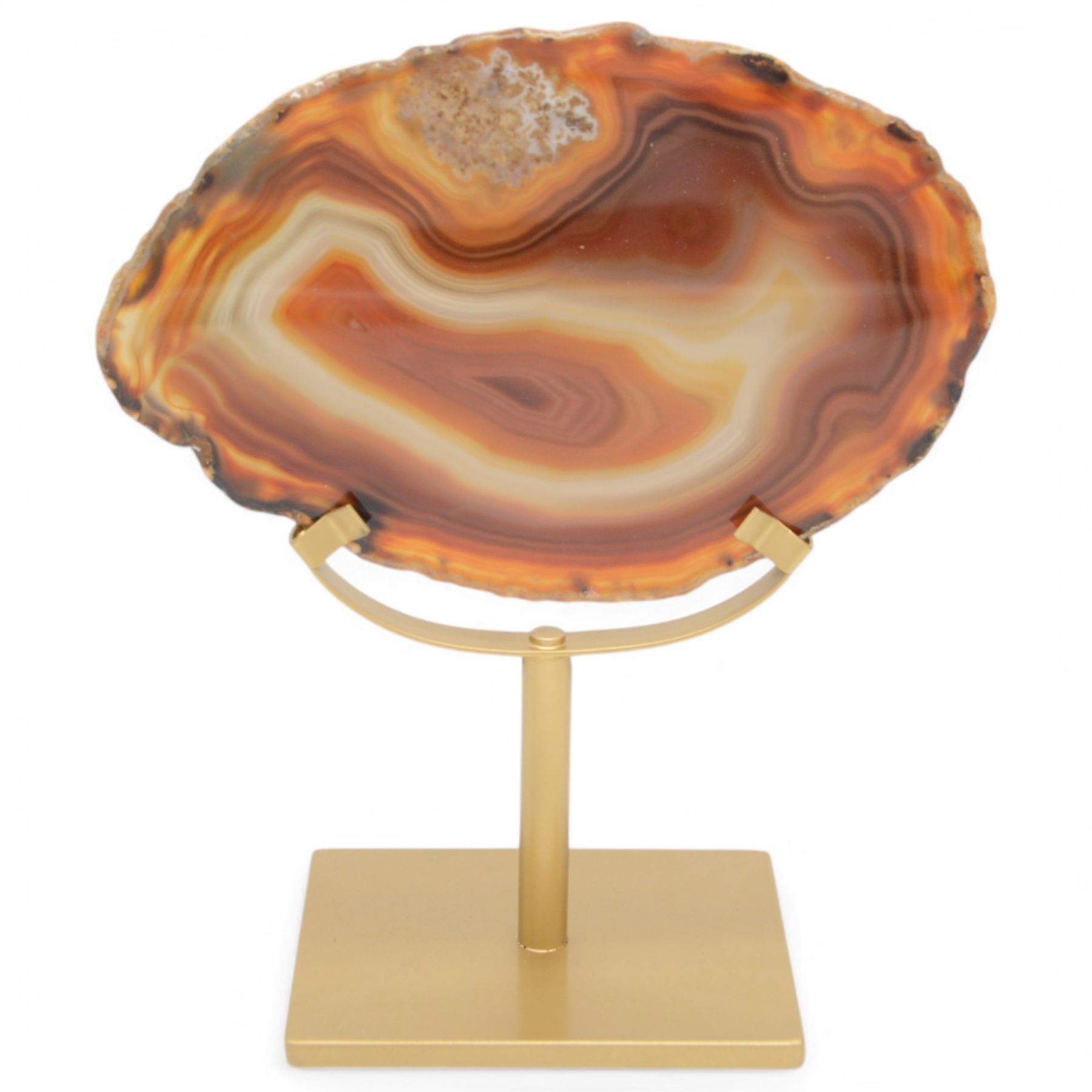 Pair of red agate slices, polished with rough edges raised upon gilt metal stands, H20cm