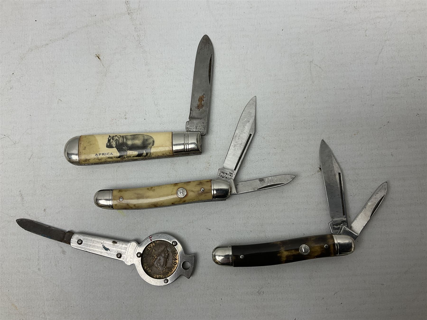 WW2 Gurkha Kukri knife with 34cm curving steel blade and horn handle; in leather covered scabbard with dual belt loops and two horn handled skinning knives L47cm overall; and collection of fourteen military and other folding and pocket knives including WW2 British Army clasp jacknife, J.H. Thompson C.C.1286 army knife dated 1954, Brookes & Crookes multiblade pocket knife etc (15)