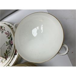 Wedgwood Hathaway Rose pattern tea and dinner wares, comprising twelve saucers, sixteen teacups, twenty tea plates, jug, sucrier, thirteen shallow bowls, sauce boat and saucer, two lidded tureens, larger jug, ten dinner plates, nine smaller plates and two large oval serving dishes