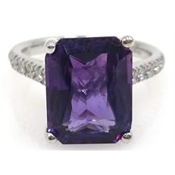  18ct white gold emerald cut purple sapphire ring, with diamond set shoulders hallmarked, sapphire 5.45 carat, diamonds approx 0.2 carat  