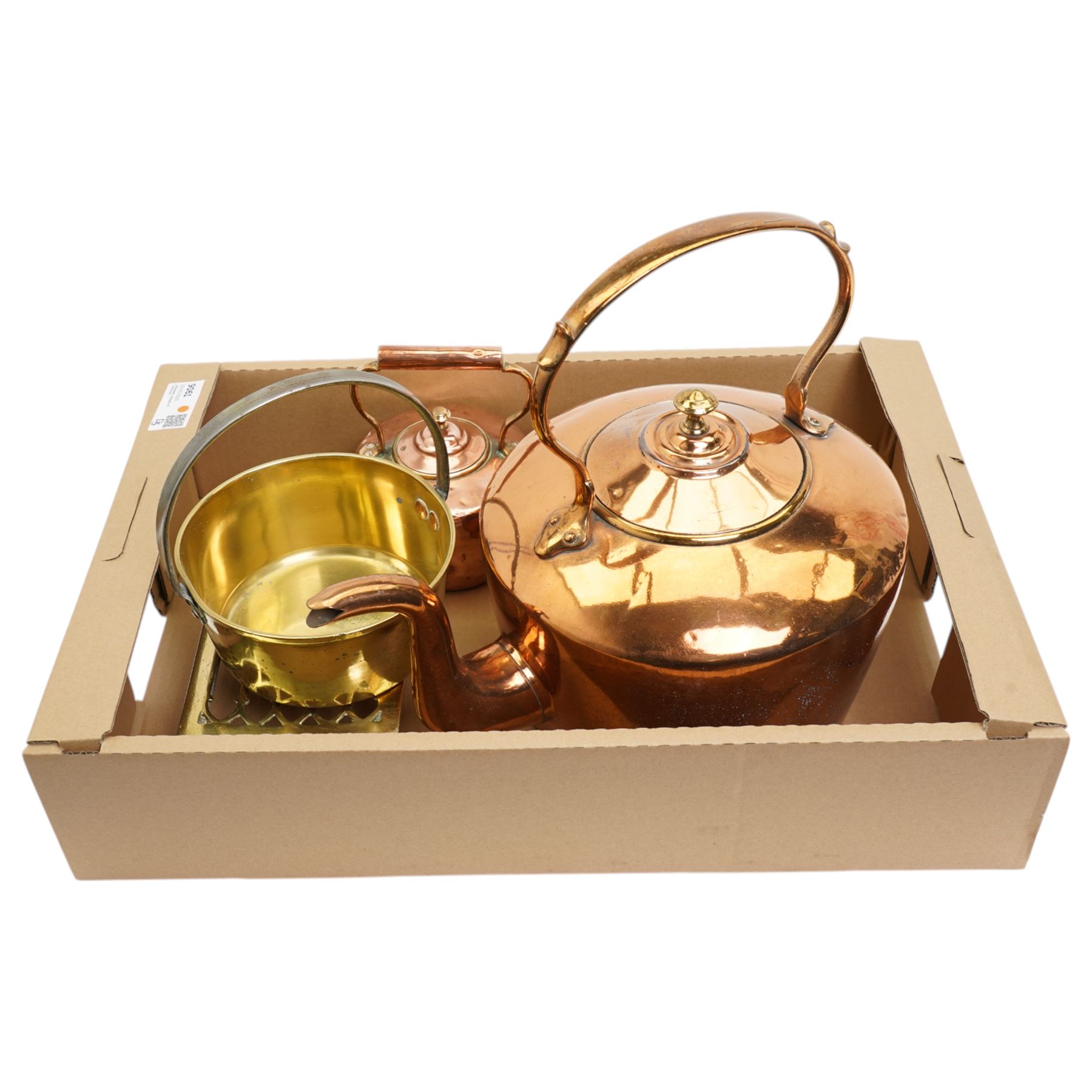 Large Victorian copper kettle, smaller kettle, brass trivet and a small brass preserve pan