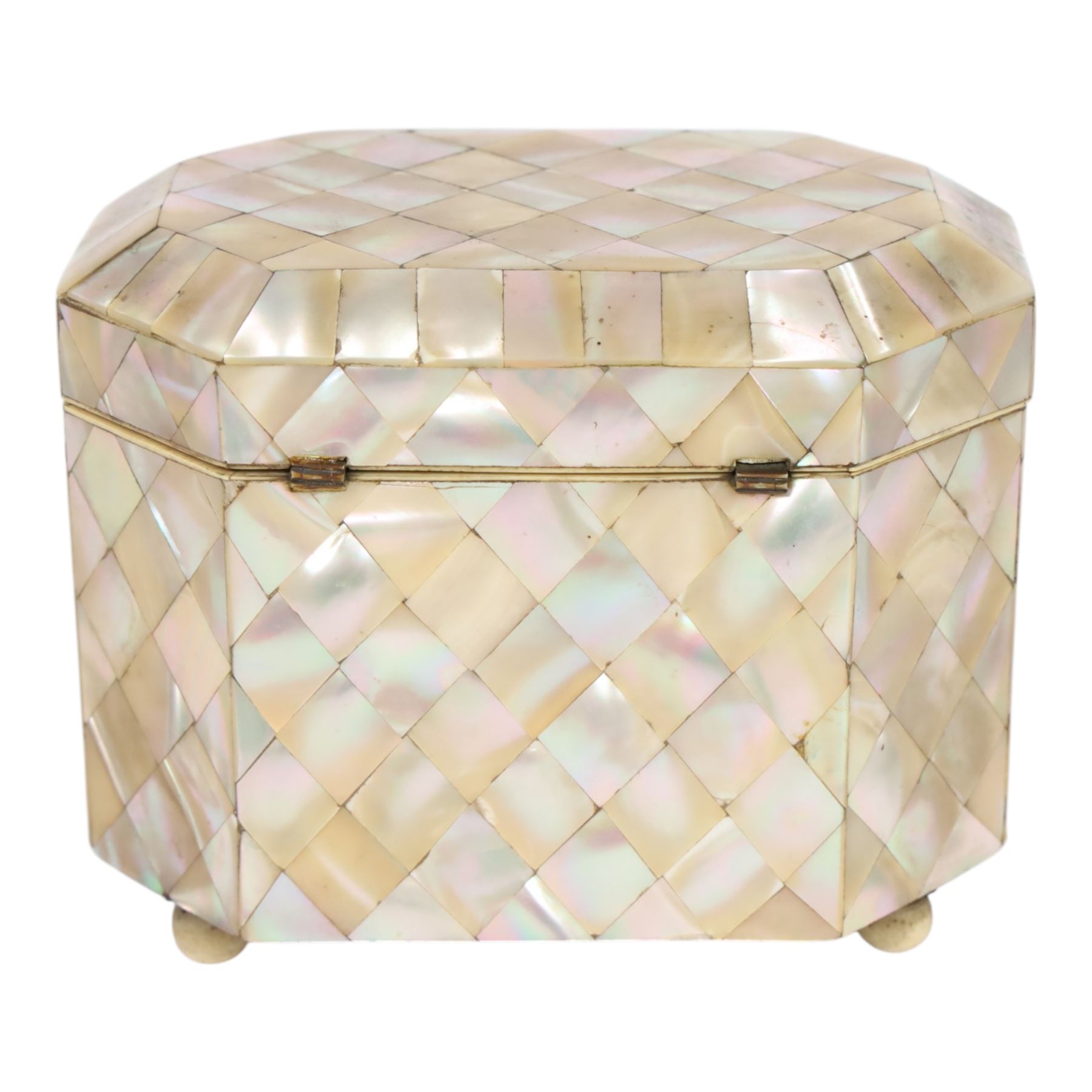 19th century mother of pearl tea caddy, of rectangular form with canted corners, the hinged lid enclosing a single lidded compartment, raised upon bun feet, H11cm D10cm L13cm
This item has been registered for sale under Section 10 of the APHA Ivory Act 