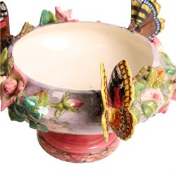 Delphin Messier (1836-1907), glazed earthenware cache-pot, decorated with three butterflies surrounded by floral and foliate motifs. upon a pink circular foot, signed beneath, H24cm