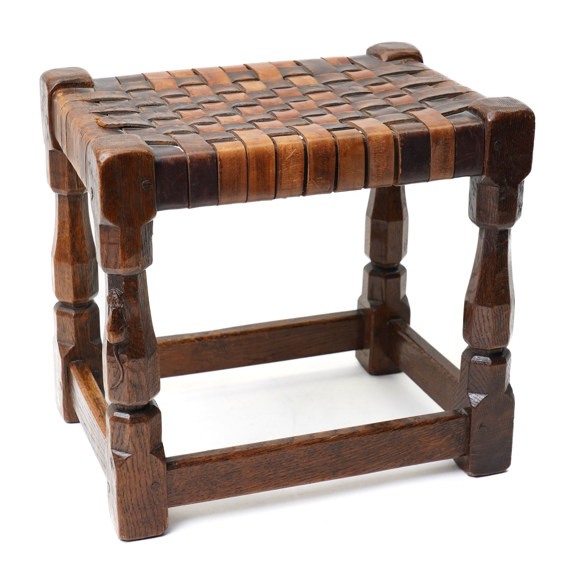 Mouseman - 1930s adzed oak joint stool, leather latticework seat on chamfered octagonal supports, carved with mouse signature, by Robert Thompson of Kilburn