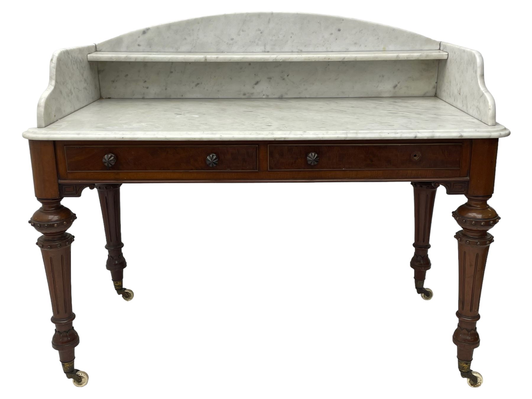 Victorian figured mahogany two-piece bedroom set - the washstand with white and black marble moulded top with arched back and raised shelf, two moulded frieze drawers, on turned and fluted supports with brass and ceramic castors (W123cm, D60cm, H102cm); the dressing table with raised swing mirror in moulded frame with shell and scroll carved pediment, on scrolled horns carved with foliage, four raised trinket drawers over moulded rectangular top, fitted with two drawers, on turned and fluted supports with brass and ceramic castors (W122cm, H177cm, D62cm)