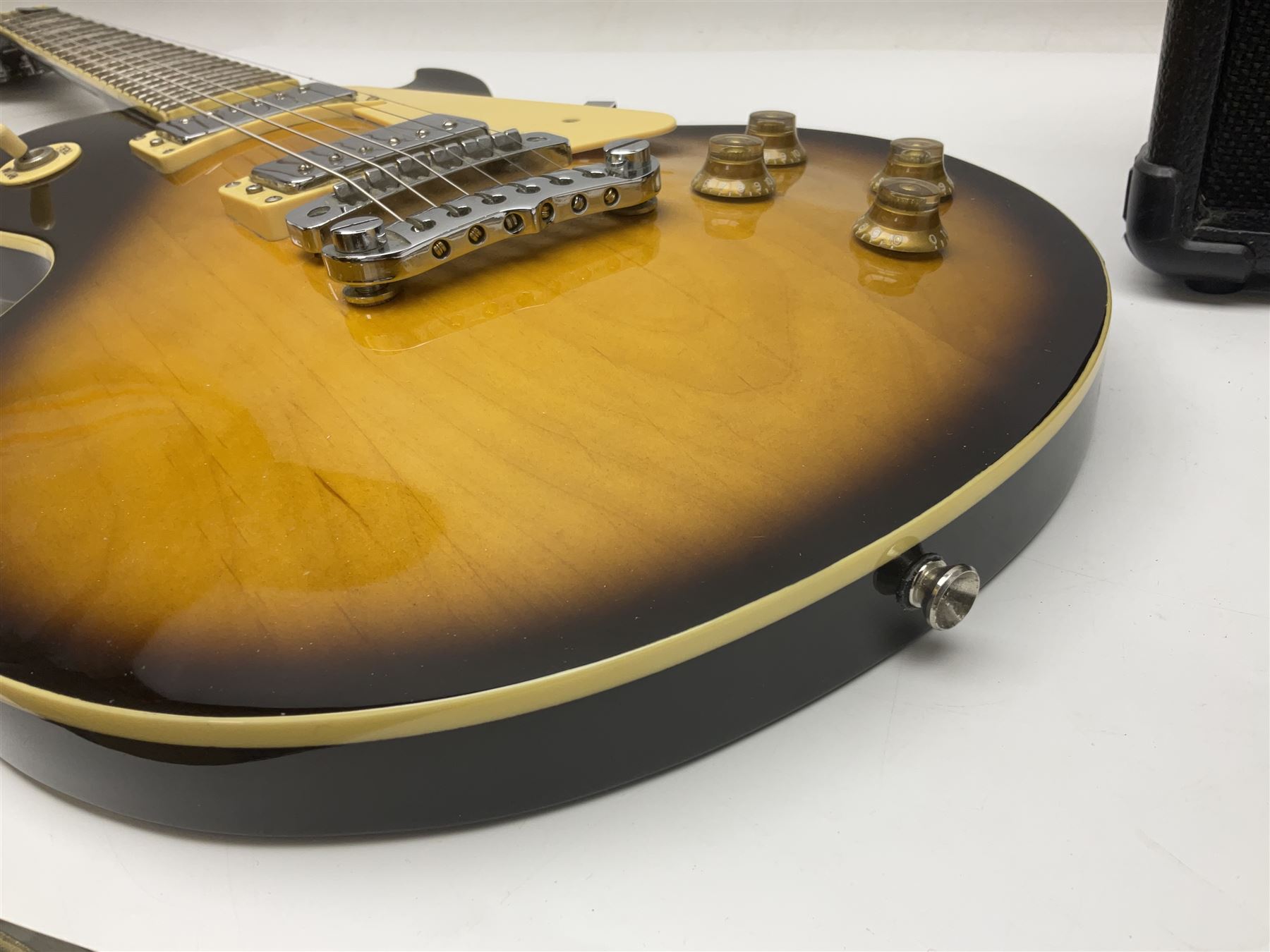 Aria Les Paul style electric guitar, no.037704CH L102cm; with amplifier, soft carrying case and stand; together with various guitar songbooks etc