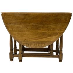 Mid-to-late 20th century oak and beech drop-leaf dining table, gate-leg action base with turned supports