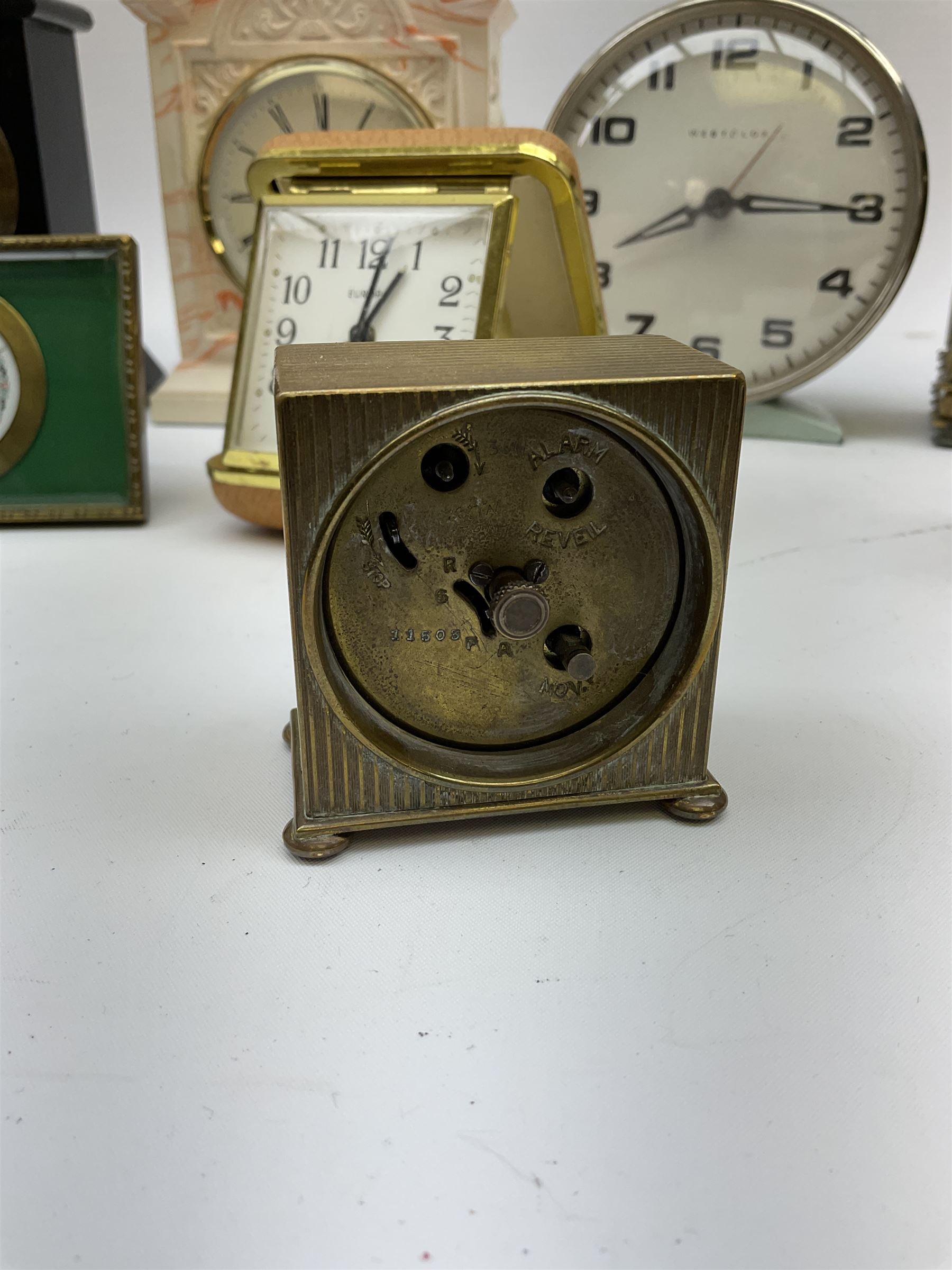 Miniature 'Zenith' travel alarm clock, in engine turned brass case with
