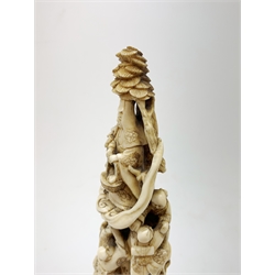 19th century Japanese carved ivory okimono, modelled as a tower of figures, H18cm 