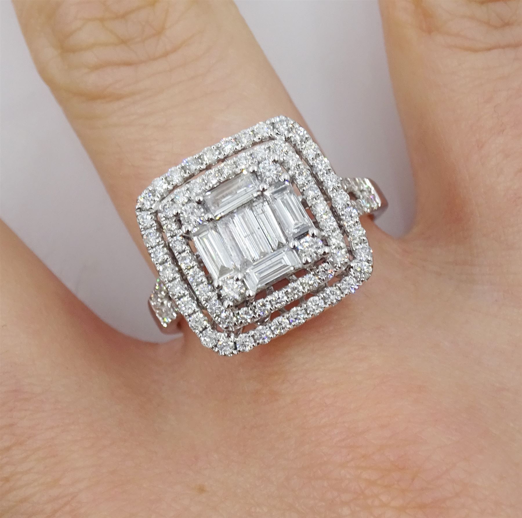 18ct white gold round brilliant cut and baguette cut diamond cluster ring, with diamond set shoulders, total diamond weight approx 1.25 carat