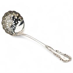 Set of four German 800 standard silver table spoons with floral stems, sifting spoon, unmarked and two teaspoons