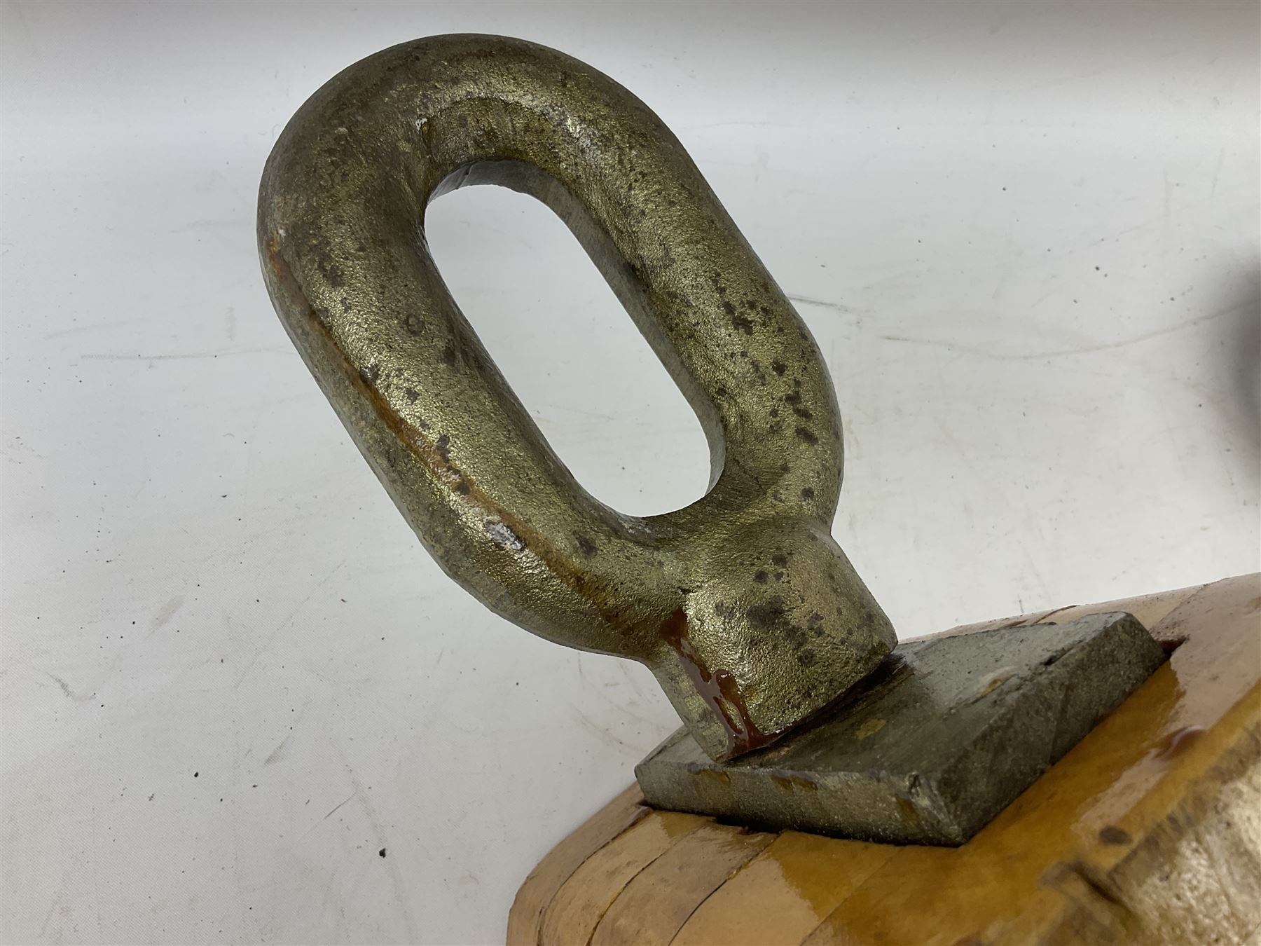 Three ship pulleys comprising wooden block double with swivel eye marked 'wooden block 240mm double rope: 22mm',  wooden block double with upset shackle and wooden block with stiff swivel hook, largest example L50cm