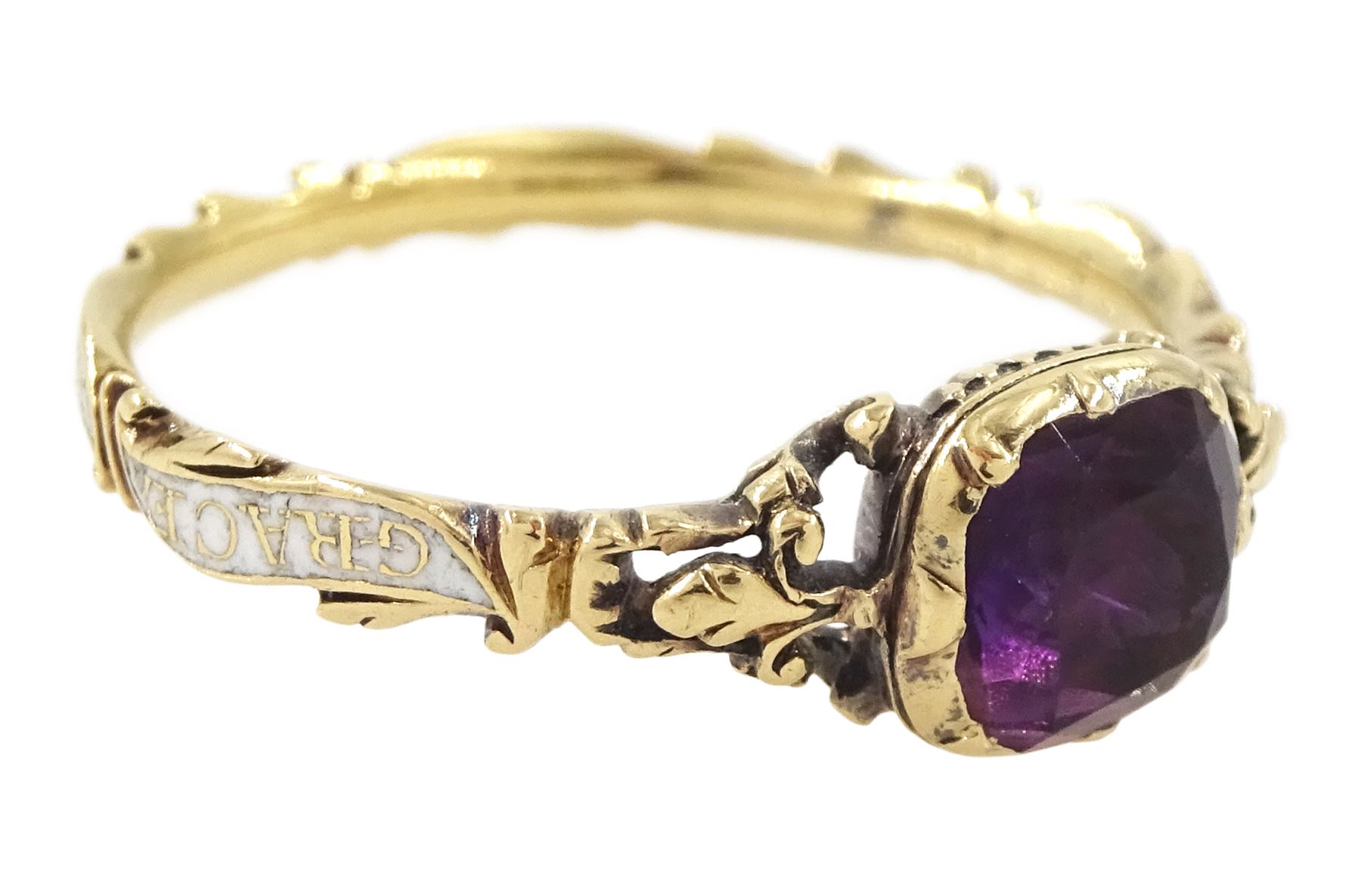 George II 18ct gold amethyst and enamel mourning ring, single cushion cut amethyst, with foiled and glazed back, to pierced fleur-de-lis shoulders, the white enamelled shank engraved Grace Hutchinson OB: 13 Dec: 1756