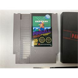 Nintendo Entertainment System (1985) console with two controllers, accessories and instruction booklet. NES Games ‘Duck Hunt’ with Nintendo Zapper gun, ‘Pinball’ and ‘Super Mario Bros.’, all with original sleeves and instruction booklets. NES game ‘Super Mario Bros. 2’ cartridge only