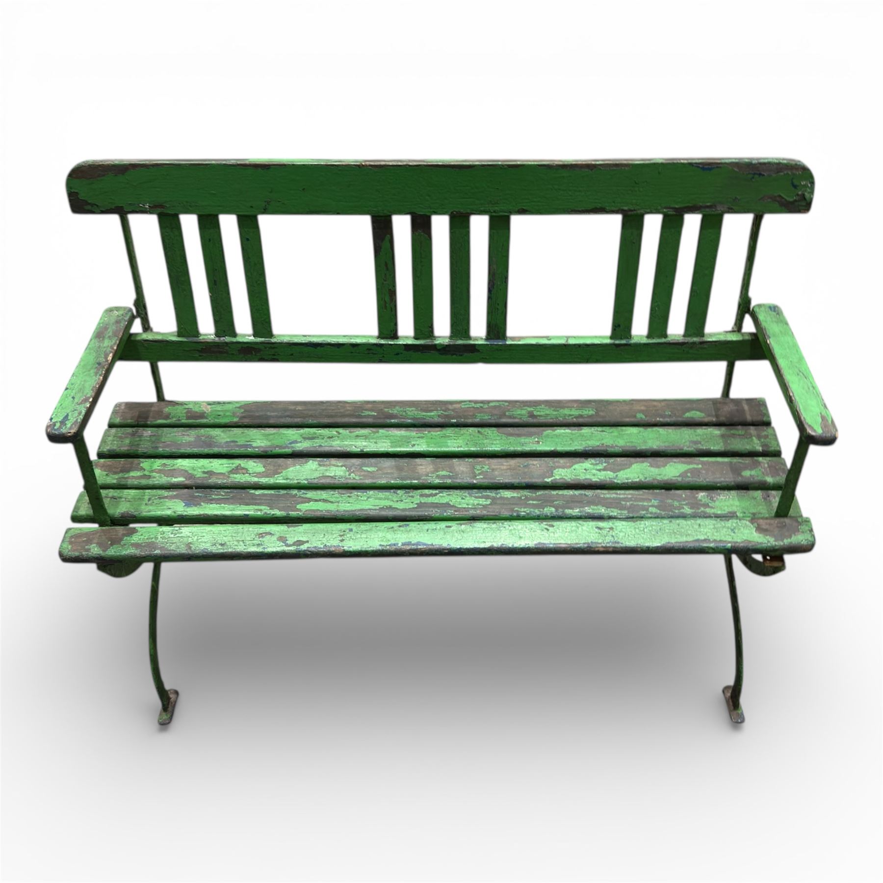 Early 19th century child's garden bench, the wrought iron frame with X frame legs and wooden slatted seat, painted in green, H63cm L90cm D35cm
