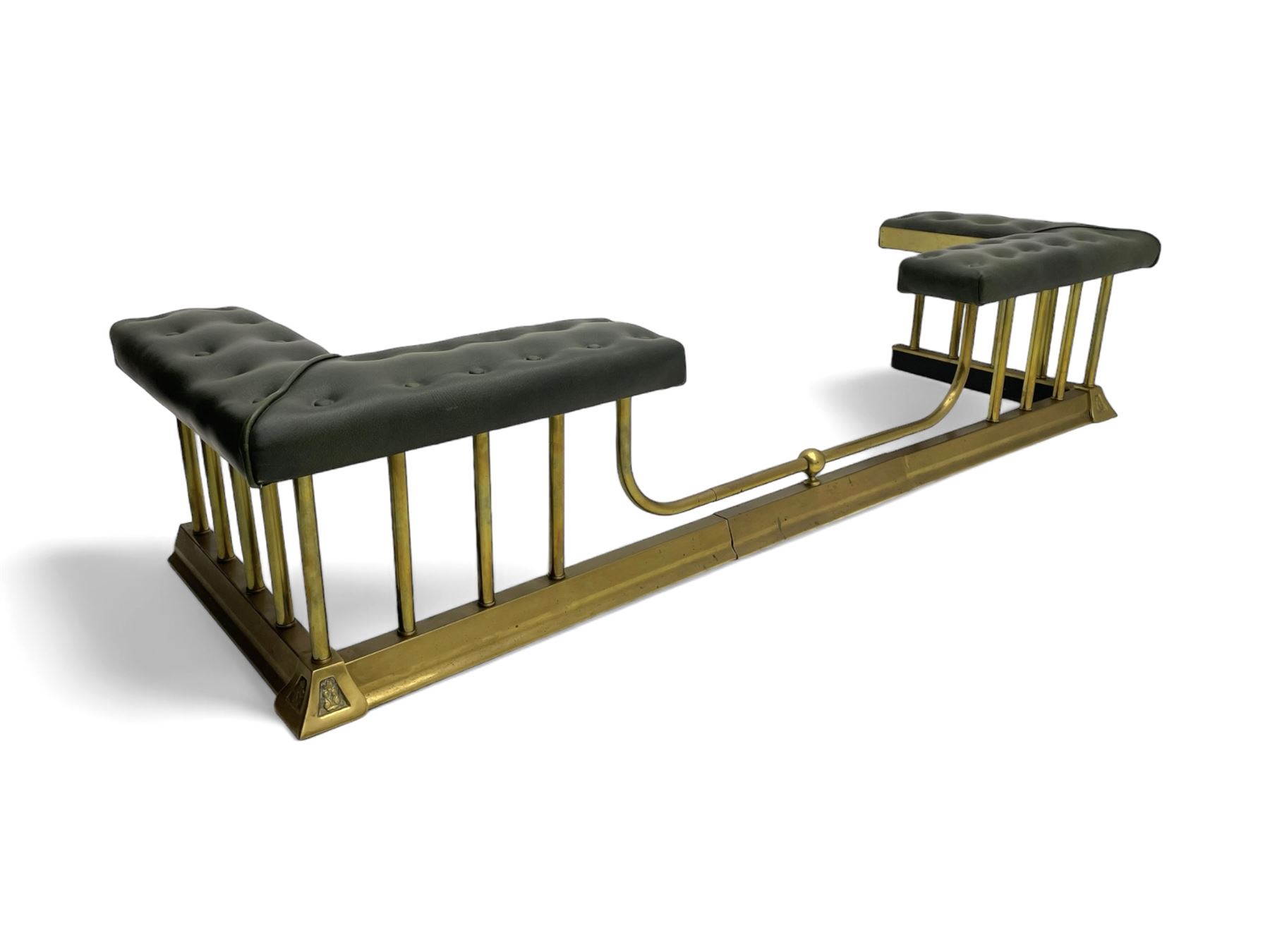 Victorian design brass telescopic extending club fire fender, the corner seats upholstered in buttoned green fabric over plain balustrade, on moulded base with floral cast corner brackets 