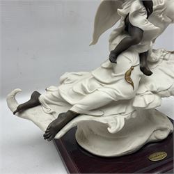 Giuseppe Armani Florence figure, Black Maternity, modelled as a mother and child upon a stylised cloud and mahogany base, H32cm