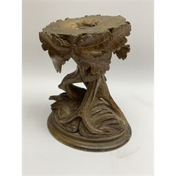 19th century Black Forrest style pedestal, carved with a bird stood before entwining trunks detailed with oak leaves and acorns, upon an oval base, H22cm
