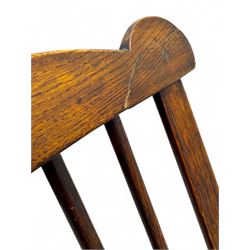 Early-to-mid 19th century elm and ash high-back Windsor armchair, central vase-shaped splat flanked by slender vertical spindles, outward-curving arms, shaped and dished saddle seat, raised on turned and splayed supports united by H-stretcher