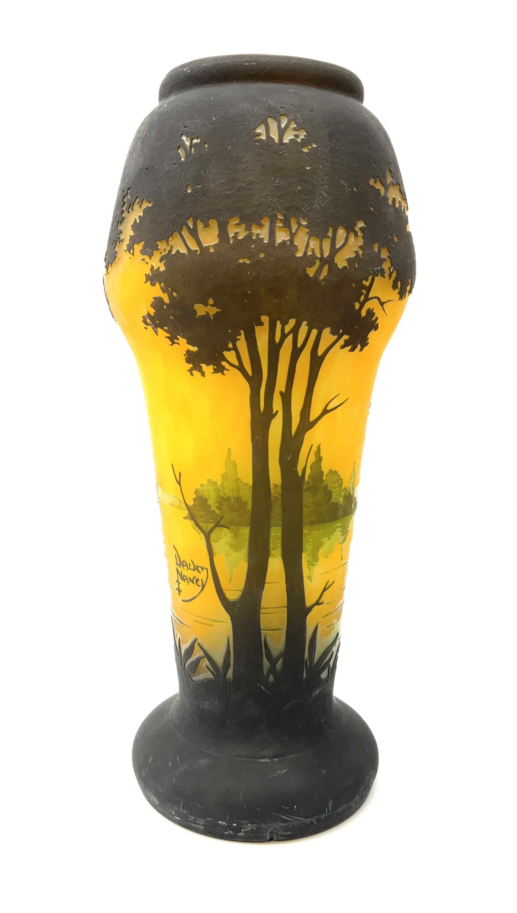 Reproduction Daum Nancy art nouveau style overlay and cut glass vase  decorated with woodland and a lake scene on a yellow ground, H35cm. 