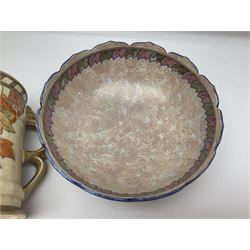 Charlotte Rhead for Crown Ducal ceramics, comprising coffin shaped vase depicting a woman in 1920s dress, a vase with handle, decorated with autumn leaves and a bowl, decorated with flowers and berries, with printed and signed marks beneath, coffin vase H24cm