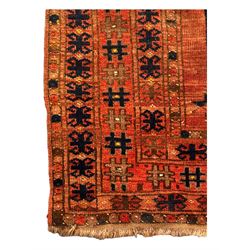 Turkish Kilim ground rug, the field with alternating horizontal bands of geometric patterns, bordered by repeating diamond motifs (145cm x 242cm); Turkish red ground rug, the field with three octagonal medallions (113cm x 172cm) (2)