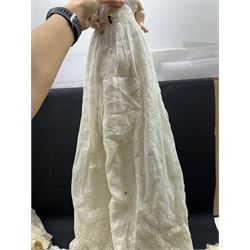 Two German bisque head dolls, to include a Franz Schmidt example with blue glass eyes and an Armand Marseille 590 example with applied hair, together with a Schoenau & Hoffmeister bisque doll's head, pair of doll's hands and a collection of clothing