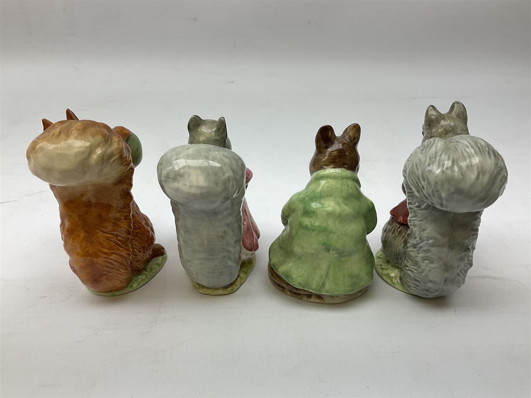 Seven Beswick Beatrix Potter figures, comprising, The old woman who lived in a shoe, Anna Maria, Samuel Whiskers, Johnny Town-Mouse, Timmy Tiptoes, Goody Tiptoes and Squirrel Nutkin, all with printed mark beneath 